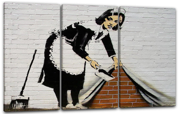 Leinwandbild Banksy - Putzfrau kehrt Dreck unter Wand-Bemalung Graffiti Street Art