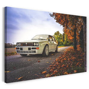 Leinwandbild Autobilder Lancia Delta weiß in Herbstlandschaft