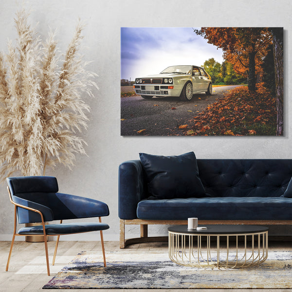 Leinwandbild Autobilder Lancia Delta weiß in Herbstlandschaft