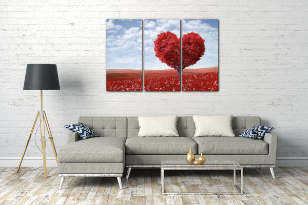 Leinwandbild roter Baum mit Herzforn in roter Blumenlandschaft