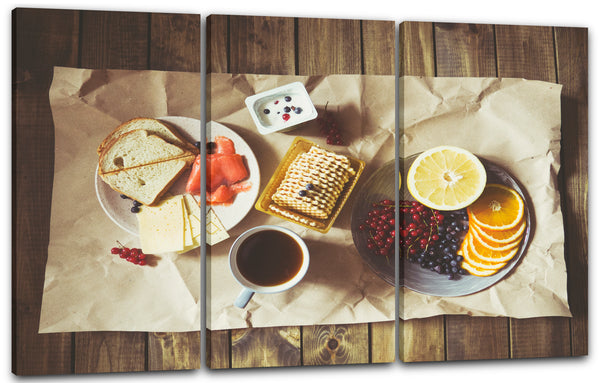 Leinwandbild Essensbilder Frühstück bunte Zusammenstellung auf hellem Holztisch