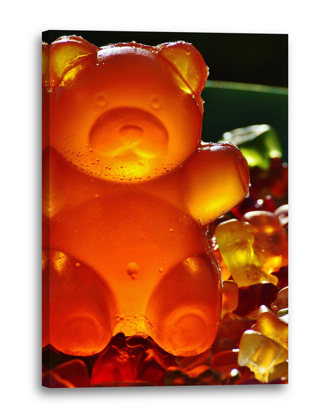 Leinwandbild Wandbild Küchendeko großer Gummibar neben kleinen Gummibären