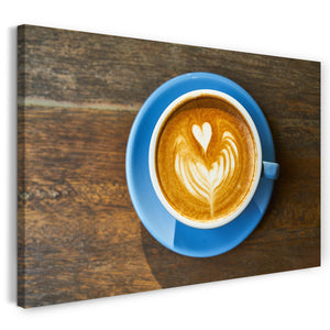 Leinwandbild Wandbild Cappuccino Latte Art blaute Tasse auf Holztisch