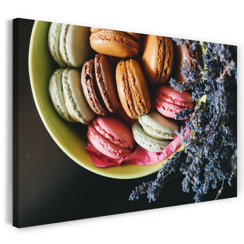 Leinwandbild Wandbild bunte Macarons (braun, grün, rosa) in grüner Schale