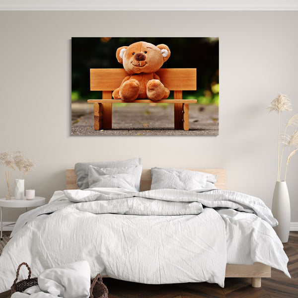 Leinwandbild Wandbild süßer Teddybar auf Holz-Bank sitzend Plüschtier knuffig